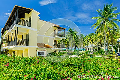 Charming view of Colonial hotel grounds, beautiful inviting retro stylish buildings in tropical garden Editorial Stock Photo