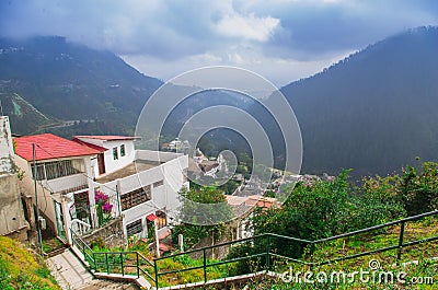 Charming village of Guapulo in Quito Ecuador with houses built downward valley, spectacular view Andes mountains Stock Photo