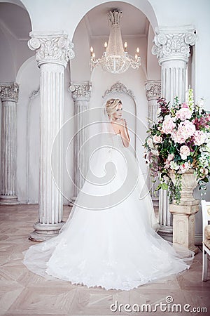 Charming young bride in luxurious wedding dress. Pretty girl, the photo Studio Stock Photo