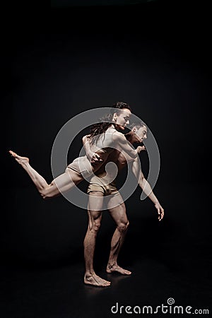 Charming young gymnasts performing together in the studio Stock Photo