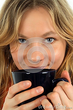 Charming young woman drinking tea Stock Photo