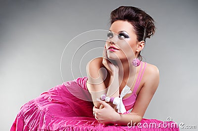 Charming young woman in pink dress Stock Photo