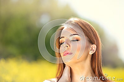 Charming young woman touching her perfect neck Stock Photo