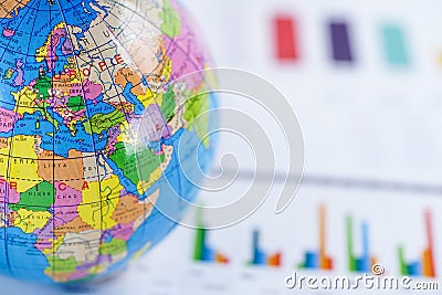 Chart graph paper with globe world Europe map on . Finance, Account, Statistics, Investment, Analytic research data economy. Stock Photo