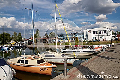 Charzykowy, Pomeranian Voivodeship / Poland - July 20, 2019: Marina and moored sailboats at the lake harbor. Sailing port in Editorial Stock Photo