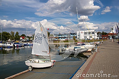 Charzykowy, Pomeranian Voivodeship / Poland - July 20, 2019: Marina and moored sailboats at the lake harbor. Sailing port in Editorial Stock Photo