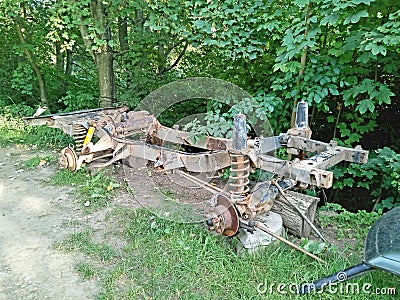 Chassis of old Landrover in grass Stock Photo