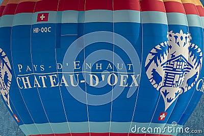 Hot Air Balloon flying in the sky. Hot air ballooning with mention pays d'enhaut. Balloon festival Editorial Stock Photo