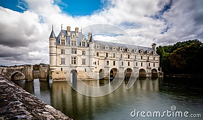 Chateau de Chenonceau over peaceful river waters. Editorial Stock Photo