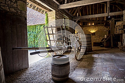 Chateau du Clos de Vougeot. Old casks of a winery and cart. Cote de Nuits, Burgundy, France. Stock Photo