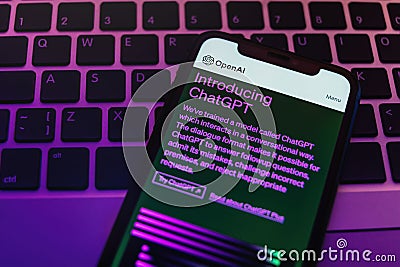 The ChatGPT chatbot on the smartphone display in neon light. Editorial Stock Photo