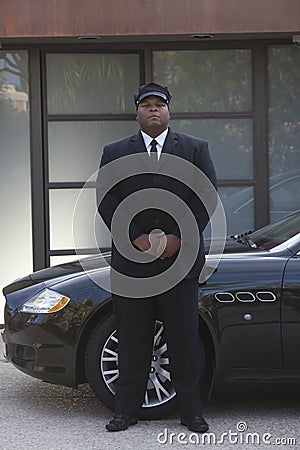 Chauffeur Standing By Car Stock Photo