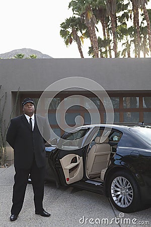 Chauffeur Standing By Car Stock Photo