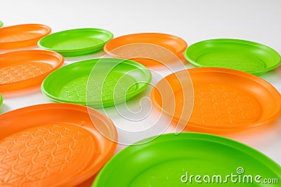 Cheap plastic dishes for everyday use lying together Stock Photo