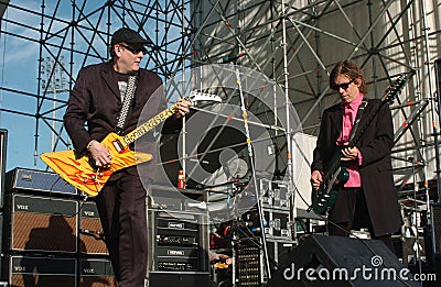 Cheap Trick Rick Nielsen Guitarist and Tom Petersson Electric bass during the concert Editorial Stock Photo