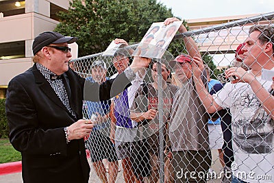 Cheap Trick lead guitarist Rick Nielsen signs autographs for fans. Editorial Stock Photo