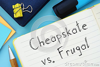 Cheapskate Vs. Frugal sign on the piece of paper Stock Photo