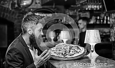 Cheat meal concept. Hipster hungry eat italian pizza. Pizza favorite restaurant food. Fresh hot pizza for dinner Stock Photo
