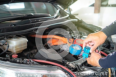 Check car air conditioning system refrigerant recharge Stock Photo