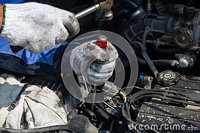 Check engine ignition system and change ignition coil. Car care service..Replacing ignition coil and spark plugs. Stock Photo