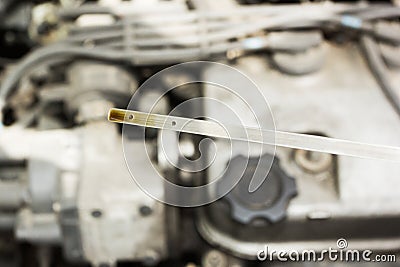 Check the oil level of the car against the engine Stock Photo