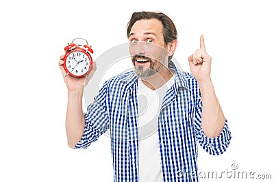 Check up time. Timekeeping and time measurement. Mature timekeeper with analog clock pointing finger up. Mature man Stock Photo