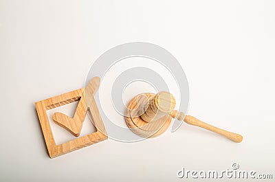 Checkbox and hammer of the judge. Check mark. The concept of a judicial decision. Referendum and electoral process. Resolution, ap Stock Photo