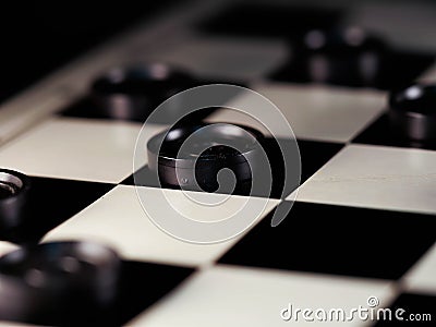 Checkerboard with checkers. Game concept. Board game. Hobby. checkers on the playing field for a game. Stock Photo