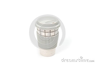 Checkered ceramic cup with rubber lid, shot against a white background Stock Photo