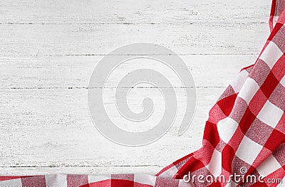 Checkered picnic blanket on wooden background, top view Stock Photo