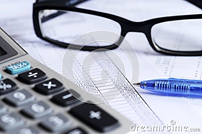 Checking accounts with a calculator Stock Photo