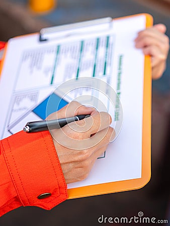 Checking on the chemical hazardous material form. Industrial safety working. Stock Photo