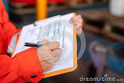 Checking on the chemical hazardous material form. Industrial safety working. Stock Photo