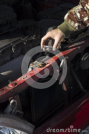 Checking the coolant level in the car. The cap of the radiator, check fluid, replacement fluid. Stock Photo