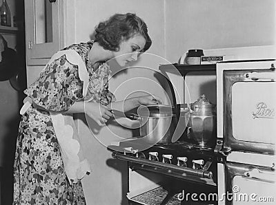 Checking on dinner Editorial Stock Photo