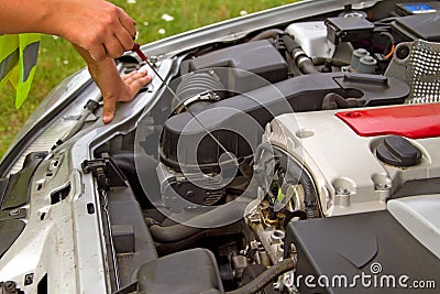 Checking engine oil Stock Photo