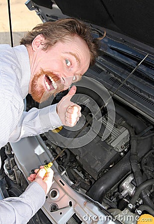 Checking engine oil dipstick Stock Photo