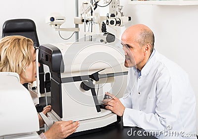 Checking eyesight in clinic. Stock Photo