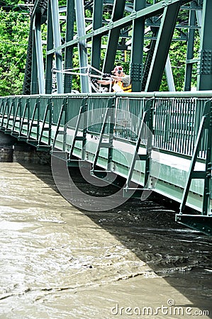 Checking floodwaters on the Winooski River in Montpelier, Vermont Editorial Stock Photo