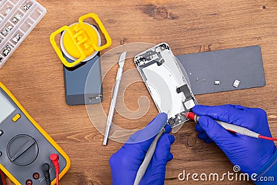 Checking for a mobile device malfunction and replacing a broken screen when falling Stock Photo