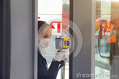 Checking people`s temperature . Determining the temperature of a large flow of people. Epidemiological Thermal Imager. Safety and Editorial Stock Photo