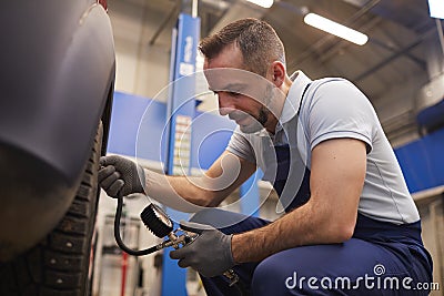 Checking Pressure in Tires Stock Photo