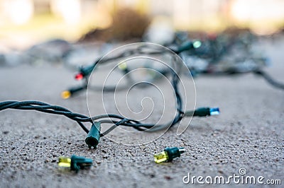 Checking and replacing a dead bulb on a string of christmas lights Stock Photo