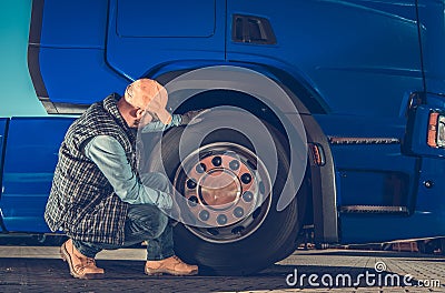 Checking Semi Truck Wheels Stock Photo