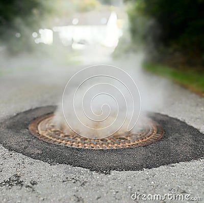 Checking sewer under smoke Stock Photo