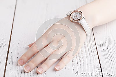 Checking time, female wrist watch on hand Stock Photo