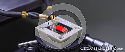 Checking turn on small oled display of red color with a probe station Stock Photo