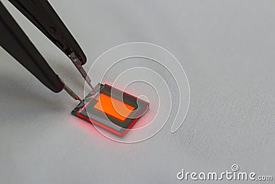 Checking turn on small oled display of red color with a probe station Stock Photo