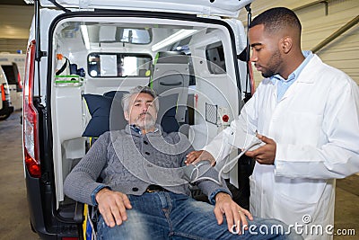 Checking victim`s pulse rate Stock Photo