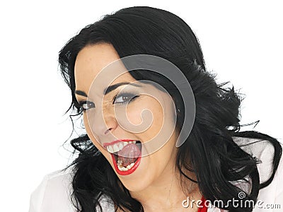 Cheeky Beautiful Young Hispanic Woman Pulling Silly Faces and Sticking Tongue Out Stock Photo